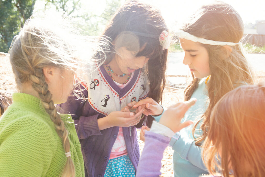 Three girls outside playing